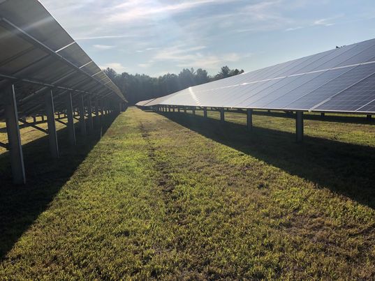 Solar farm field mowing in New York f